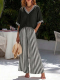 Women's striped tunic top and casual trousers two-piece set by FitiqueFit, featuring a relaxed fit and comfortable fabric.