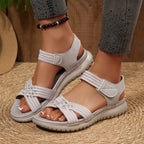 Women's open toe woven strap flat sandals by Trendsi, featuring faux leather slides with comfortable, stylish design.