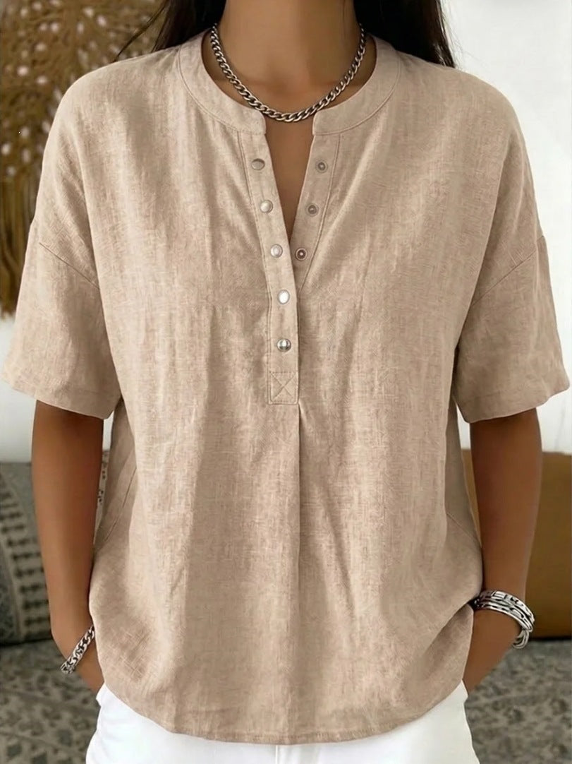 Light pink women's loose-fit short-sleeve pullover top by Plush Fashion Hub, casualwear, with a relaxed fit and solid color.