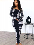 Colorful tie-dye long sleeve maxi dress by Shopimist with a flowing silhouette and vibrant, swirling patterns.