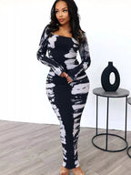 Colorful tie-dye long sleeve maxi dress by Shopimist with a flowing silhouette and vibrant, swirling patterns.