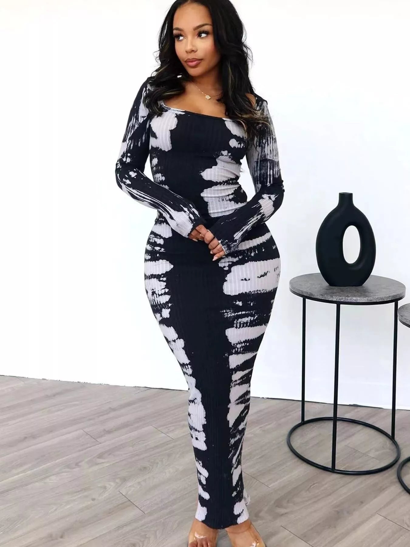 Colorful tie-dye long sleeve maxi dress by Plush Fashion Hub, flowing fabric with vibrant patterns and a relaxed fit.