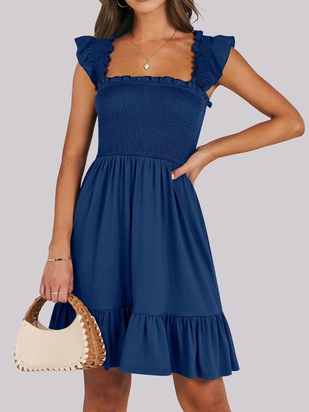 Women's lightweight smocked ruffle hem mini dress from Trendsi, casual summer dress with breezy style and flowy fabric.