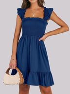 Women's lightweight smocked ruffle hem mini dress from Trendsi, casual summer dress with breezy style and flowy fabric.