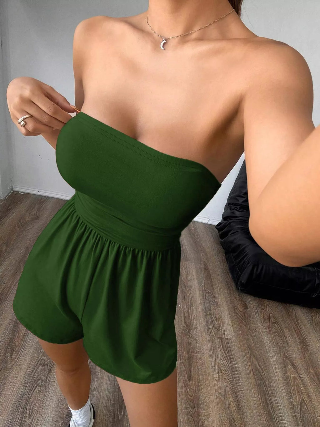 Chic strapless romper with ruched waist and relaxed fit, featuring trendy design and lightweight fabric by Trendsi.