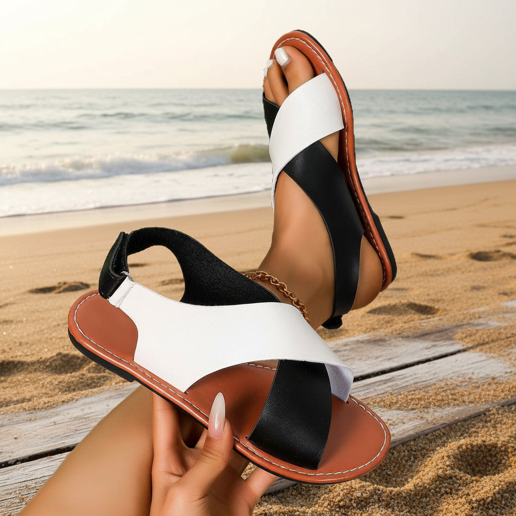 Women's color-block cross-strap flat sandals by FitiqueFit, showcasing vibrant straps and comfortable flat sole.