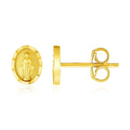 14k yellow gold oval religious medallion post earrings with intricate design, crafted by Plush Fashion Hub.