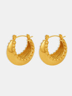 18K gold-plated stainless steel huggie earrings with a sleek, minimalist design and secure clasp.