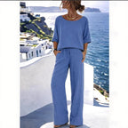 Women's resort set by FitiqueFit featuring a short sleeve top and wide-leg pants, perfect for warm-weather casual wear.