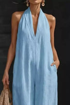 Women's sleeveless wide-leg jumpsuit with pockets, casual chic romper by Trendsi, shown in a relaxed fit with a stylish silhouette.