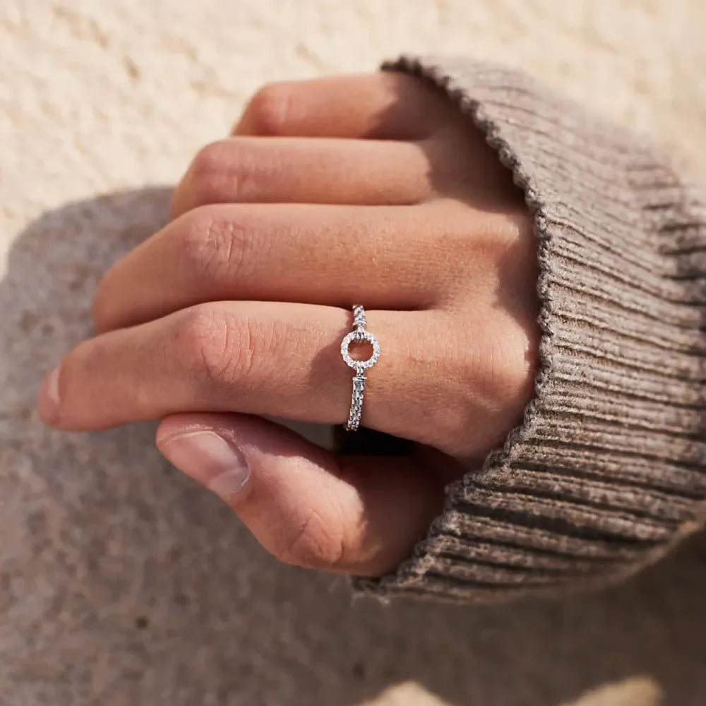 Sterling silver ring with inlaid zircon stones, crafted in 925 silver, featuring a detailed and elegant design.