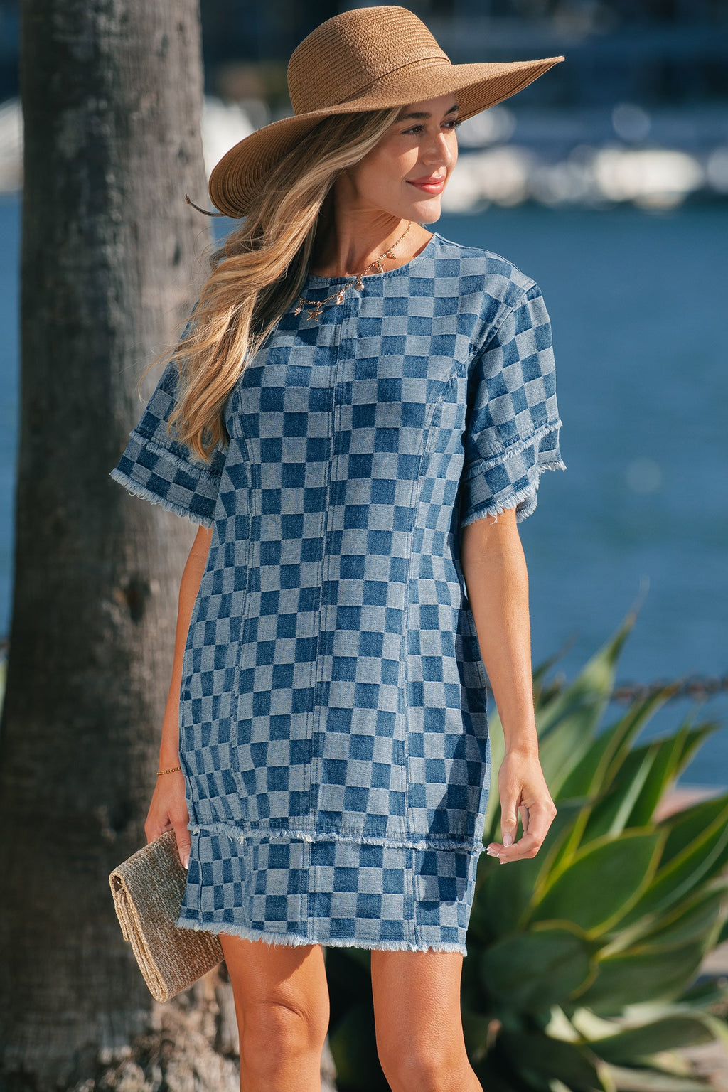 Threaded Pear Jessie Hem Checkered Mini Dress shown on a model, featuring a stylish checkered pattern and mini length.