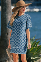 Threaded Pear Jessie Hem Checkered Mini Dress shown on a model, featuring a stylish checkered pattern and mini length.