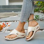 Women's faux leather toe post wedge sandals with mid-heel, stylish design and comfortable fit from Trendsi.
