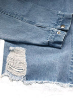 VYSN raw hem denim jacket with collared neck and long sleeves, featuring a casual, stylish design in a classic blue denim fabric.