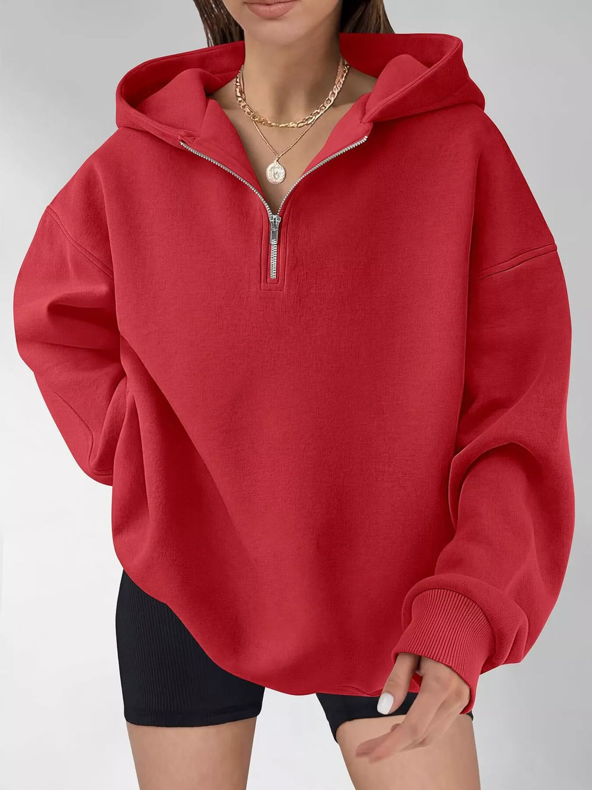 Oversized quarter-zip hoodie from Trendsi, showing a soft, comfortable tops garment with a zipper and relaxed fit.
