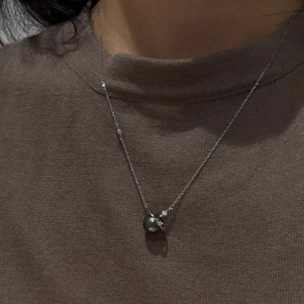 Planet Pearl Pendant Necklace by Shopimist featuring a luminous pearl pendant on a delicate chain.