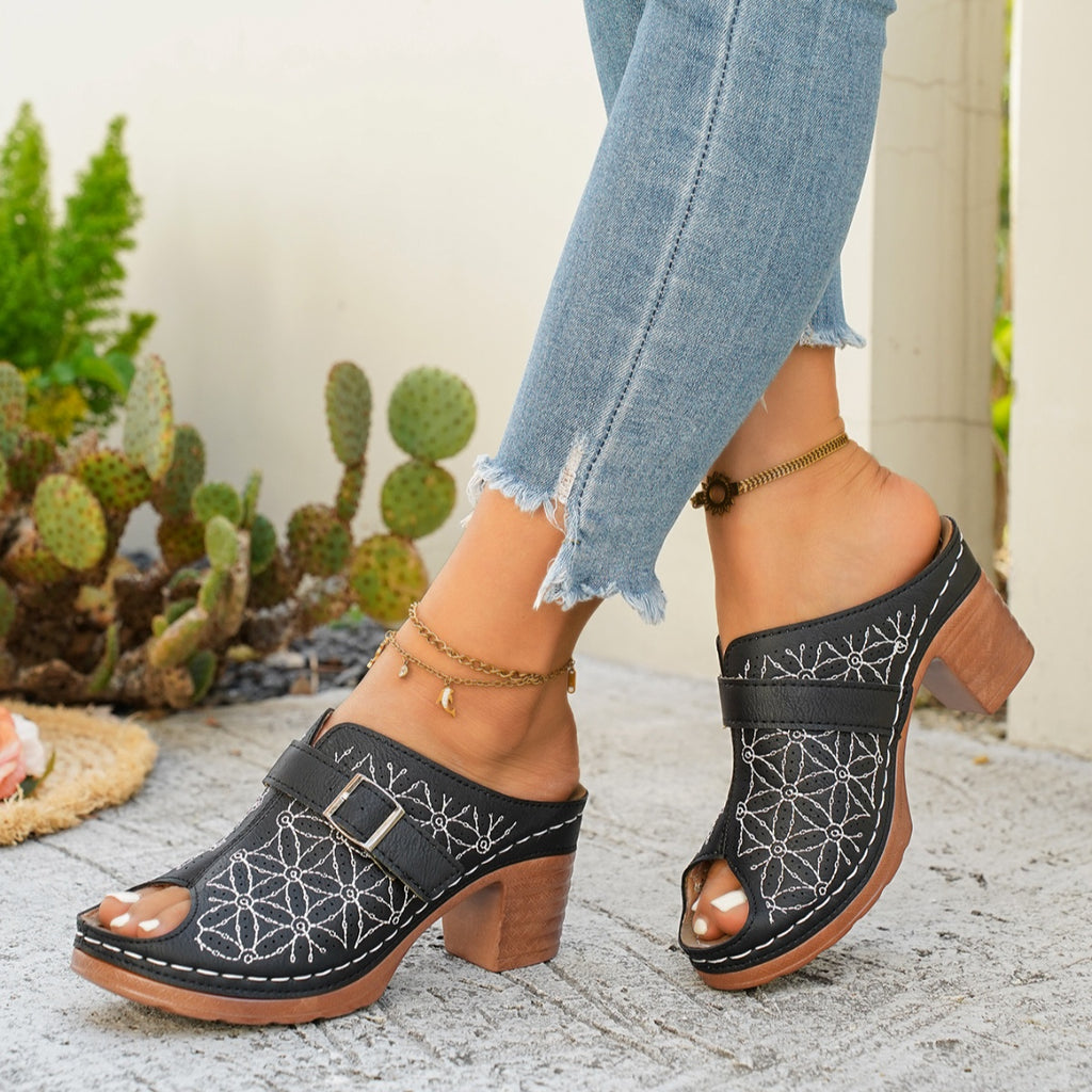 Women's chic buckle detail block heel sandal in premium faux leather, stylish shoe with adjustable strap and sturdy heel.