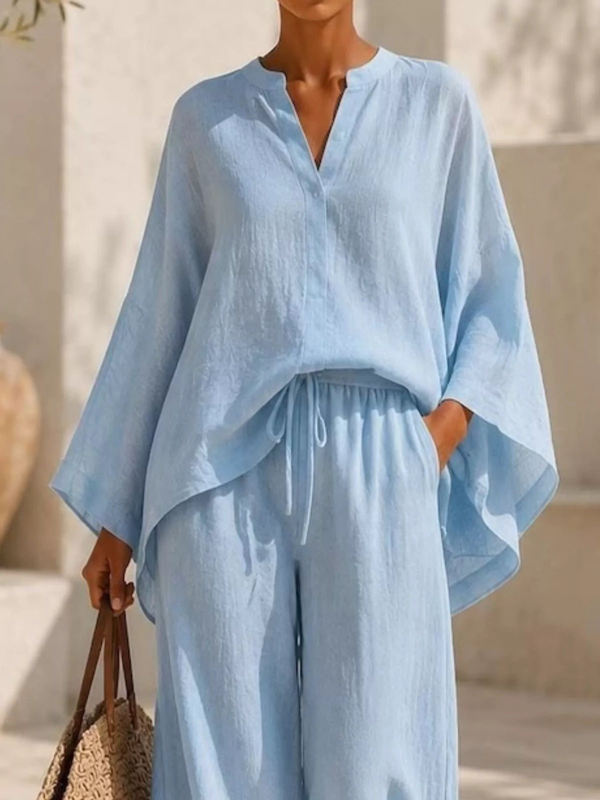 Plus size plush fashion hub loungewear set with full notched long sleeve top and wide-leg pants for comfortable casual wear.