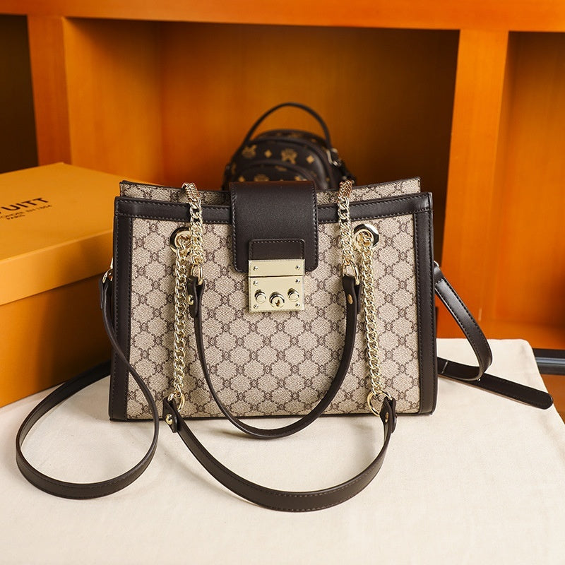 Genuine leather women's fashion bag with stylish design, featuring top handles and a spacious interior for everyday use.