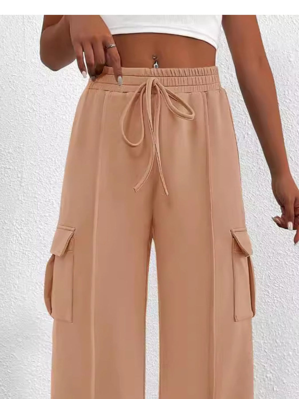 Women's high-waisted casual cargo pants with drawstring, lightweight utility pants from Trendsi, shown with pockets and relaxed fit.
