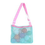 Perfecsy mesh beach toy bag for kids with seashell design, ideal for storing sand toys, pool accessories, and shells during beach days.