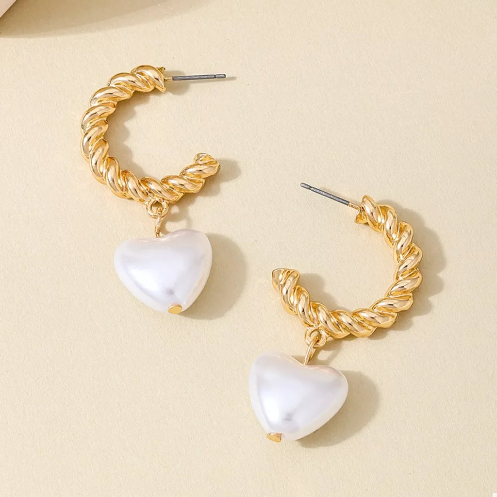 18K gold-plated C-hoop heart earrings with a delicate design, perfect for stylish and elegant jewelry accessories.