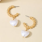 18K gold-plated C-hoop heart earrings with a delicate design, perfect for stylish and elegant jewelry accessories.