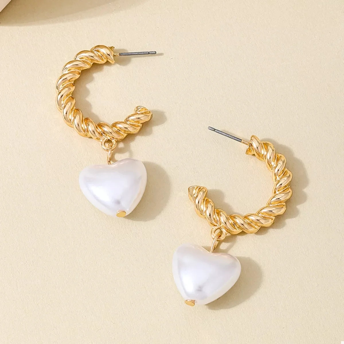 18K gold-plated C-hoop heart earrings with a delicate design, perfect for stylish and elegant jewelry accessories.