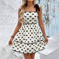 Elegant summer dress by FitiqueFit with shoulder strap and bow print, featuring a stylish bow decoration for casual wear.