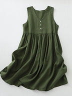 Women's V-neck sleeveless midi dress by Trendsi, 100% cotton casual dress with button details, displayed on a hanger.