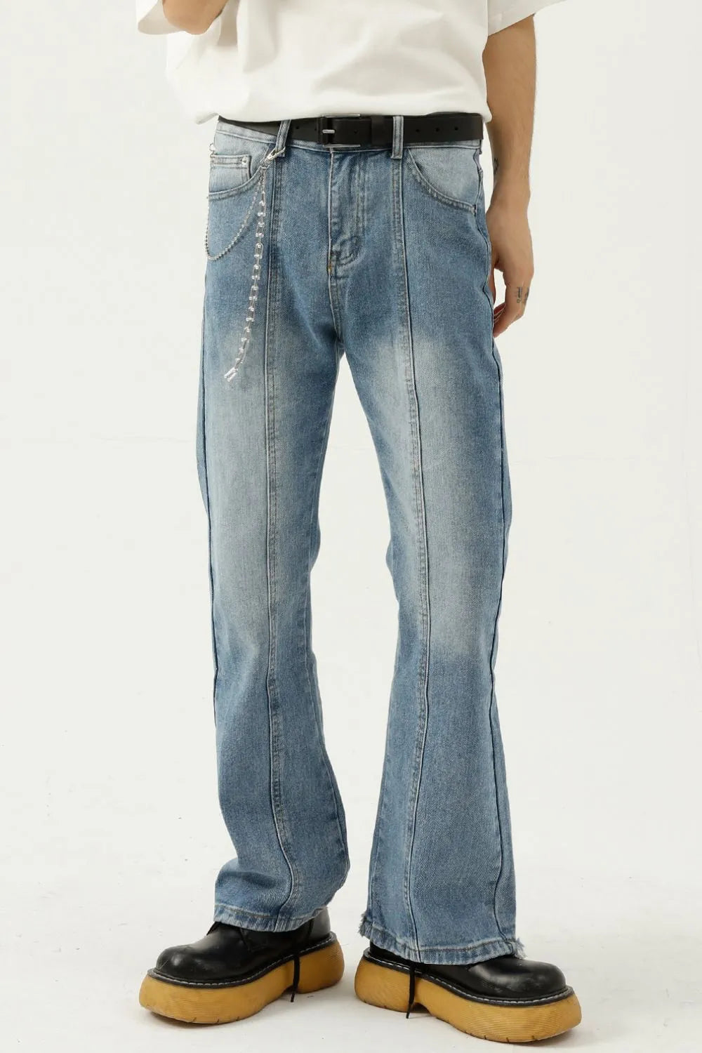Raw hem denim jeans with pockets from Trendsi, showing the distressed raw edge hem and classic five-pocket design.