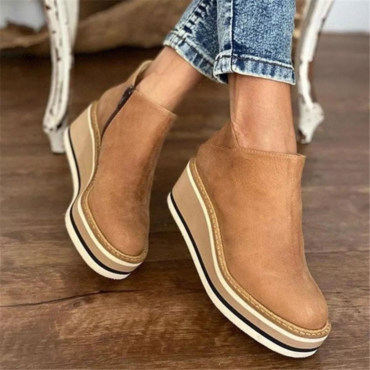 Women's ankle wedge boots with zipper, trendy and stylish, featuring a comfortable wedge heel and sleek design.