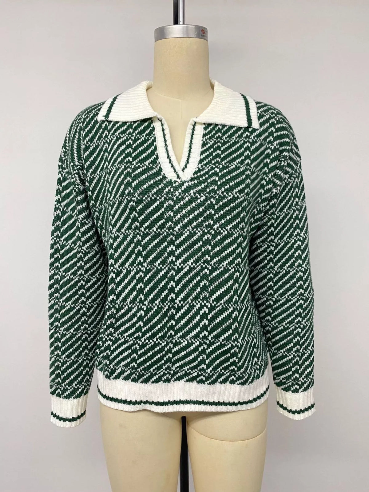 Geometric patterned collared sweater by Plush Fashion Hub, featuring a stylish design and comfortable fit in soft knit fabric.