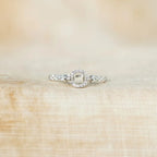 Sterling silver ring with inlaid zircon stones, crafted from 925 silver, featuring a detailed, elegant design.