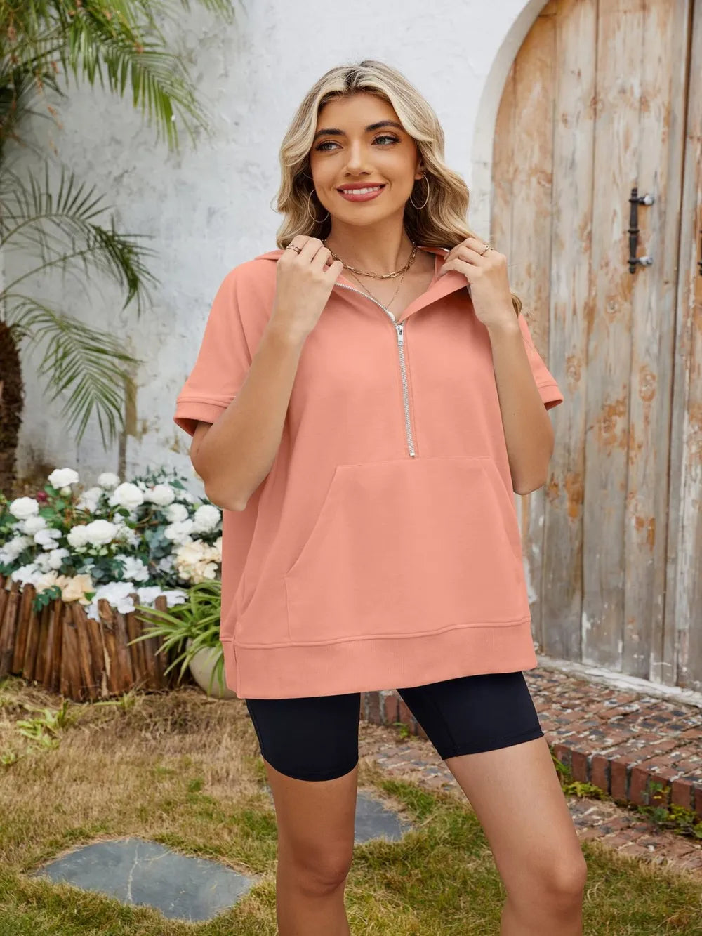 Trendsi half zip short sleeve hooded top, casual fashion tops with a front zipper and hood, displayed on a neutral background.