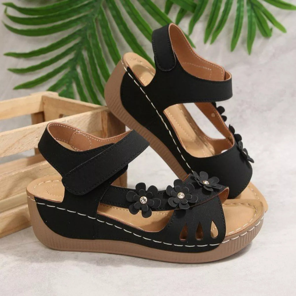 Floral embellished wedge sandals by Shopimist featuring colorful flower details and comfortable cork wedge heel.