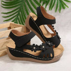 Floral embellished wedge sandals by Shopimist featuring colorful flower details and comfortable cork wedge heel.