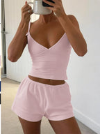 Trendsi V-neck cami and shorts activewear set, lightweight and comfortable for exercise or casual wear, displayed on a neutral background.
