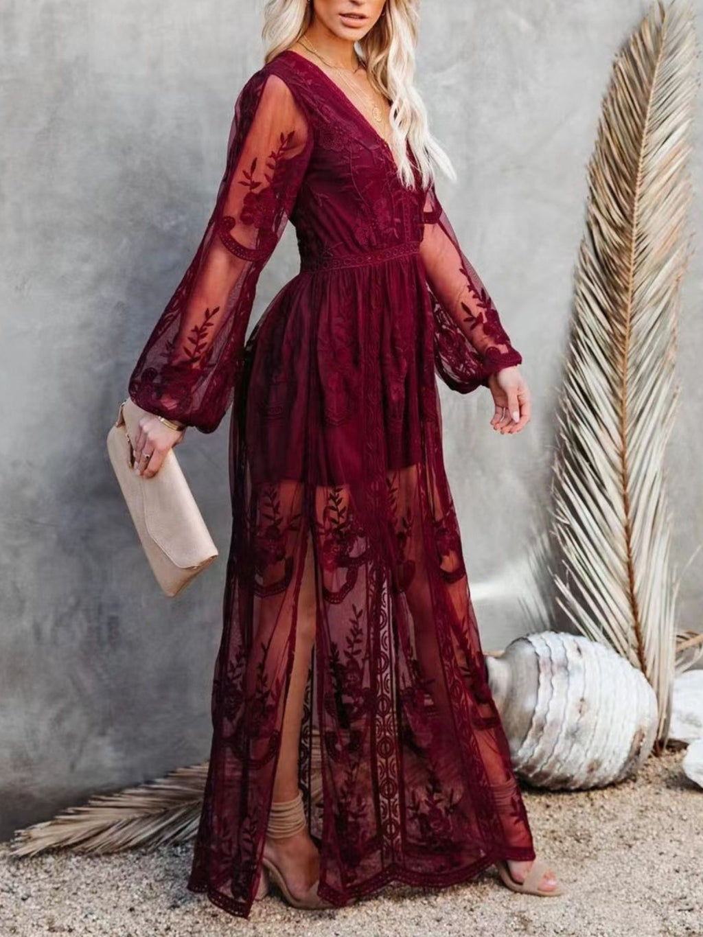 Floral lace high-slit maxi dress by Trendsi featuring an elegant evening gown with intricate lace details and a flowing silhouette.