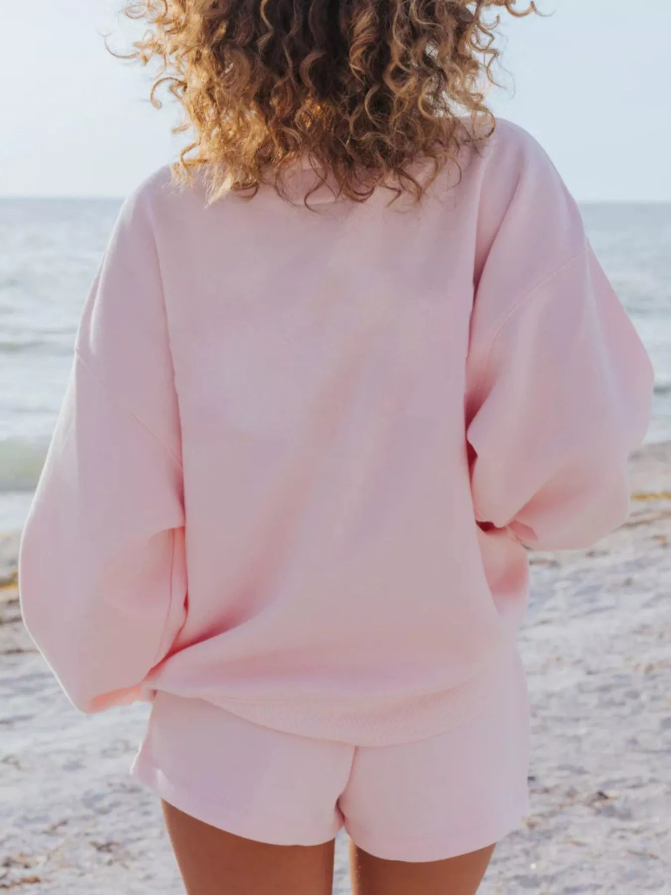 Relaxed fit round neck sweatshirt and shorts set by Plush Fashion Hub, featuring a comfortable 2-piece casual outfit.
