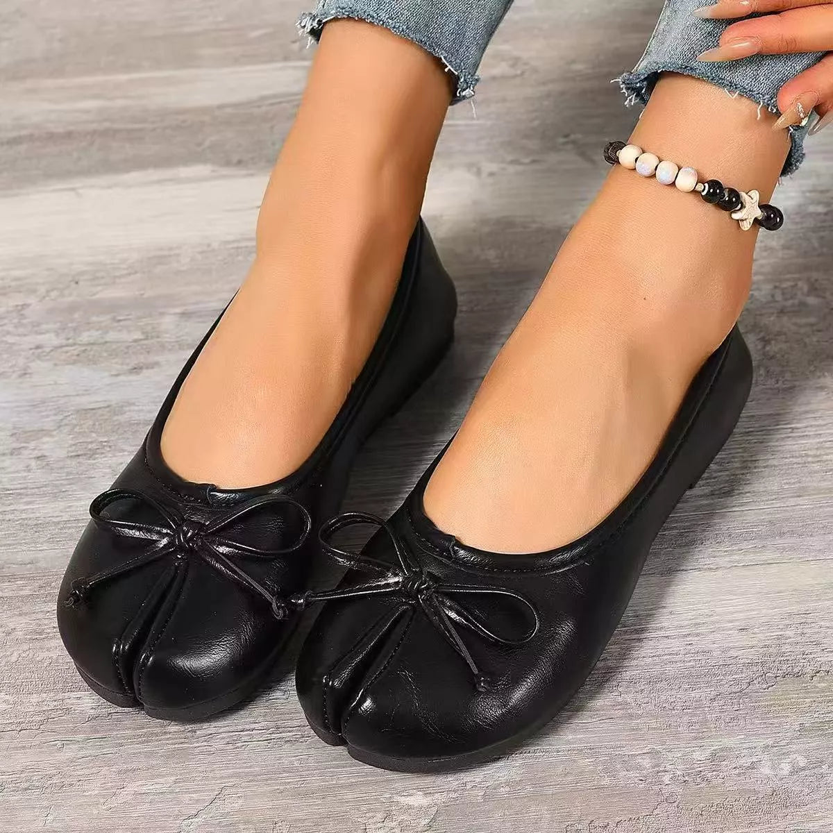 Trendsi Bow Decor Split Toe Slip-On shoes featuring a stylish design with bow accents and a comfortable slip-on style.
