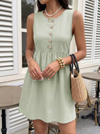 Sleeveless button-front A-line dress from Shopimist, featuring a flattering silhouette and classic design, displayed on a hanger.