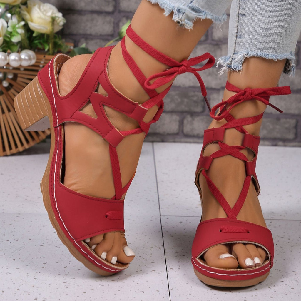 Women's lace-up block heel sandals by Trendsi, stylish mid-heel strappy shoes with a modern design and comfortable fit.