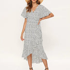 Women’s summer floral high-waist V-neck chiffon dress with a flowy design, featuring vibrant floral patterns and lightweight fabric.