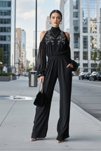 Black embroidered women's long-sleeve wide-leg jumpsuit, casualwear by Plush Fashion Hub, shown on a model.