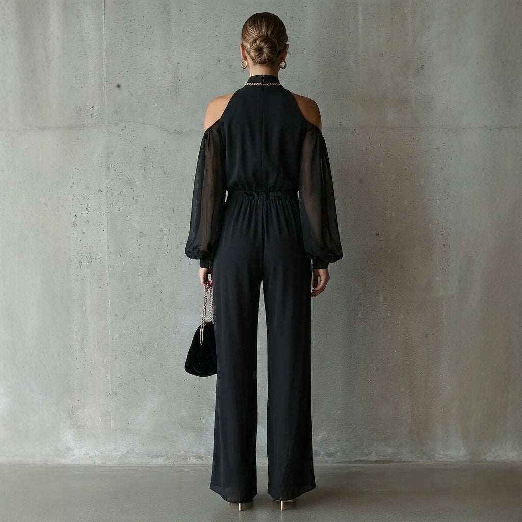 Black embroidered women's long-sleeve wide-leg jumpsuit from Plush Fashion Hub, casualwear with intricate embroidery and flowing fit.