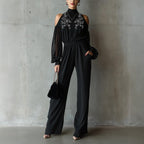 Black embroidered women's long-sleeve wide-leg jumpsuit from Plush Fashion Hub, casualwear with intricate embroidery and relaxed fit.