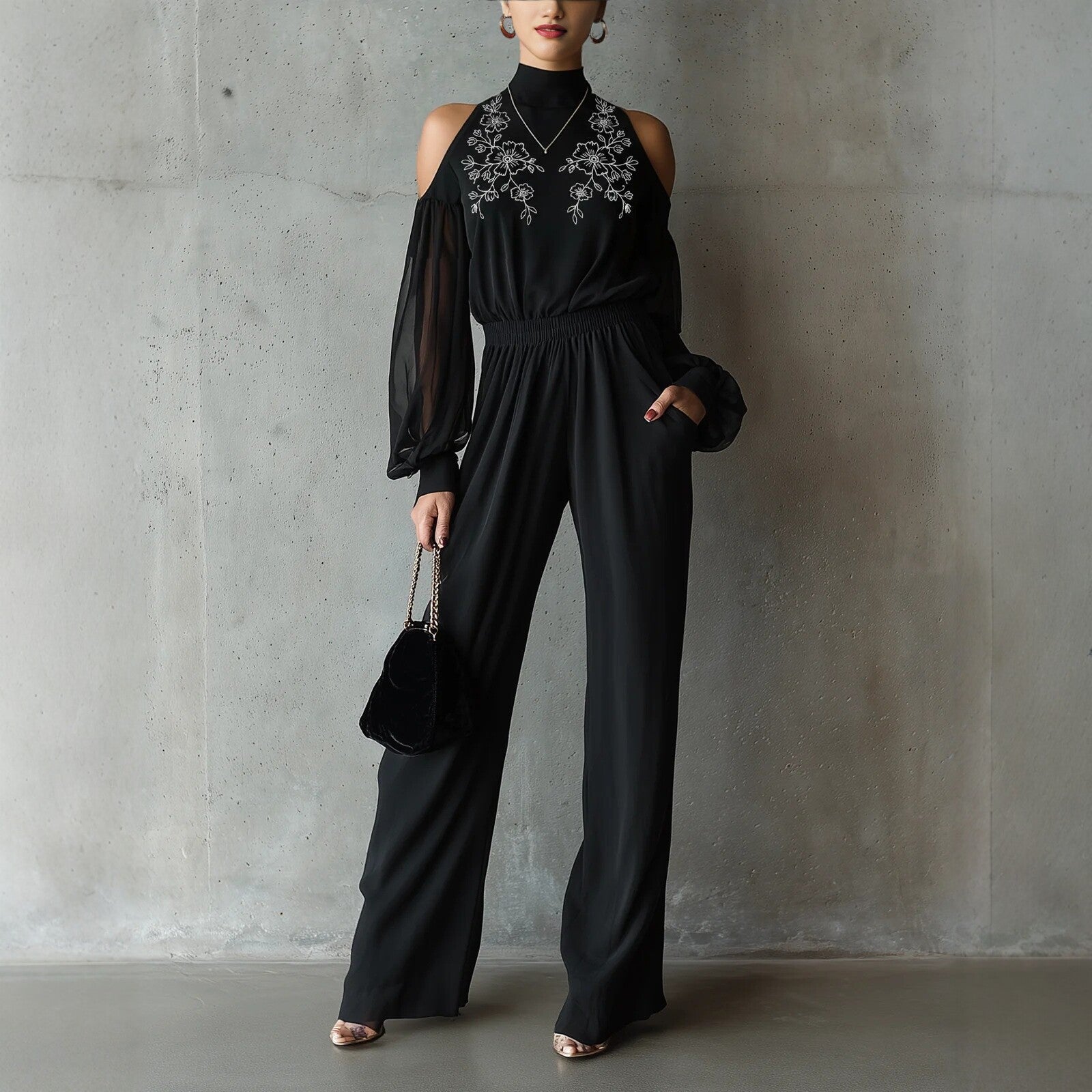 Black embroidered women's long-sleeve wide-leg jumpsuit from Plush Fashion Hub, casualwear with intricate embroidery and relaxed fit.