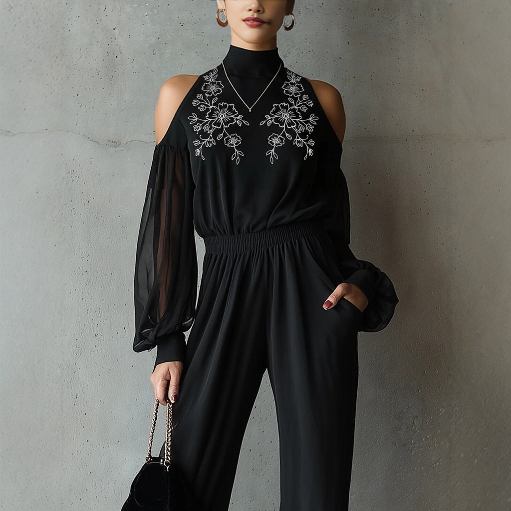 Black embroidered women's long-sleeve wide-leg jumpsuit by Plush Fashion Hub, showcasing a stylish casualwear outfit with intricate embroidery.